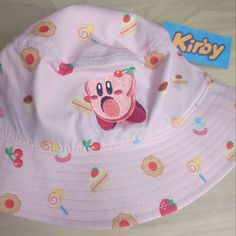 a pink hat with an image of a cartoon character on it