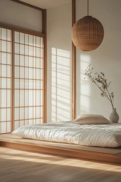 Light-filled Japandi bedroom blending Japanese minimalism with Scandinavian coziness, showcasing a DIY art project