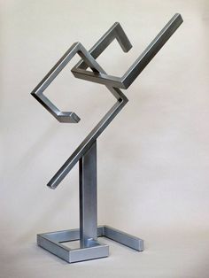 a metal sculpture is shown on a white background