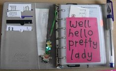 an open notebook with writing on it and a notepad attached to the cover that says well hello pretty lady