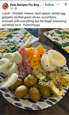 a plate filled with different types of food on top of a table next to another plate