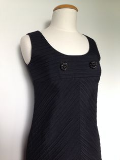 Perfect condition!! Great little black dress for a party or event!! Metal zipper down left side of dress.  Two detailed beaded buttons at chest area. Approx. size XS/S petite Tag - Ein Fink Modell/Trevira Texture Era - 60s Material - Schur-wolle, cotton, polyster, metal zipper, glass beading Bust - 32- 33.5" Waist - 29 to 31"  Empire waist, mod style Hips - 35/36" Length - 33" Condition - excellent Washin - dry clean only Beaded Buttons, Dress For A Party, 60s Mod, Rockabilly Dress, Mod Dress, Boho Maxi, Spring Summer Dress