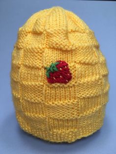 This is a handmade knit hat with a basket weave pattern. The hat is yellow and made to fit a child 3 years and up.  There are three embroidered strawberries spaced evenly around the hat. A strawberry can be seen from every angle. If you are interested in a different color hat or embroidery, please feel free to let me know. I love doing custom orders!  Little ones will stay warm outside all day long Casual Yellow Crochet Hat Hand Knitted, Casual Yellow Handmade Crochet Hat, Casual Yellow Crochet Hat, Yellow Yarn Crochet Cap, Adjustable Yellow Knitted Hat, Yellow Crochet Cap Hat, Yellow Crochet Yarn Cap, Hand Knitted Yellow Crochet Hat, Handmade Yellow Crochet Hat