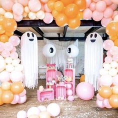 a room with balloons and decorations for a halloween party