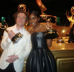 a man and woman posing with their trophies