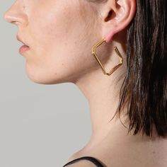 Slip these sleek folded square hoop earrings on, and add flair to your work, casual, or night wardrobe. Created with a deconstructed geometric shape and a subversive-basic design concept, these bright polished hoops exude modern minimalism.

Size: 43x42mm
Material: 18k Gold Plated On Brass Square Hoop Earrings, Basic Design, Modern Minimalism, Design Concept, Work Casual, Geometric Shapes, Concept Design, 18k Gold, Gold Plate