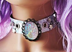 Beautiful silver and purple holographic choker. Made of faux leather thats 1.2 mm thick. 9 star studs. 8 eyelets. Two snap fasteners for back. Beautiful multicolor cameo glitter, holographic pendant. 15 inches in length. Silver Star-shaped Choker For Party, Adjustable Silver Star Choker, Dreads Diy, Glitter Choker, Holographic Choker, Uchuu Kei, Holographic Accessories, Victoria Style, Purple Holographic