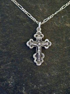 This Crucifix, Cross pendant is Sterling Silver. The included chain is a Sterling Silver Figaro 50 chain. You may choose 16, 18 or 20 inch at the same price. Other length available at sightly higher prices. This Crucifix pendant measures 1 " tall by 3/4" across. I hand cast all my pieces using the lost wax casting method. Please ask your needs. You may call me with questions, often I am out so please use my machine. 831-476-3176. Satisfaction Guaranteed!I send items USPS First Class unless other Cheap Sterling Silver Crucifix Jewelry, Silver Crucifix Chain Necklace As Gift, Spoon Necklace, Sterling Silver Spoons, Seahorse Pendant, Tahitian Black Pearls, Couple Jewelry, Hand Cast, Sterling Silver Chain