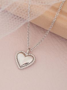 With all my heart 🤍 A heart pendant necklace makes the perfect Valentine's gift. | Ania Haie Rope Heart, Stolen Heart, Valentines Gift Guide, Silver Heart Necklace, Heart Pendant Necklace