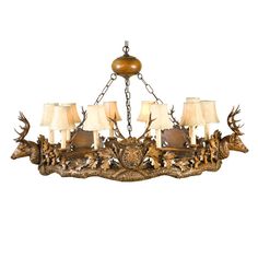 a chandelier with deer heads and lamps on it