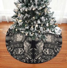 a christmas tree skirt with an image of two skulls on it