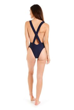 Back view of a woman wearing a navy one-piece swimsuit Poolside Beachwear Bodysuit With Closed Back, Poolside Closed Back Beachwear Bodysuit, Beachwear Bodysuit For Pool With Closed Back, Closed Back Beachwear Bodysuit For Pool, Beachwear Bodysuit With Closed Back For Pool, Low Back Bodysuit With Moderate Coverage For Pool, Summer Bodysuit With Lined Body And Closed Back, Fitted V-back Swimwear For Poolside, Beachwear Bodysuit With Closed Back