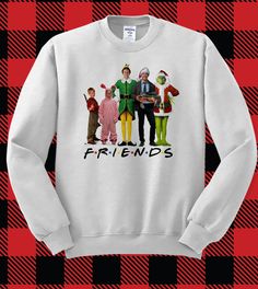 the three stooges friends sweatshirt on a plaid tablecloth with red and black checkered