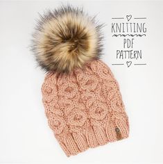 a knitted hat with a fur pom