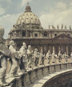 the statues are all lined up on the bridge