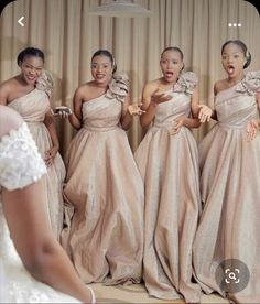 the bridesmaids are all dressed in different styles