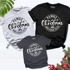 three family christmas t - shirts sitting next to each other