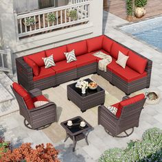 an outdoor living room with red and brown furniture