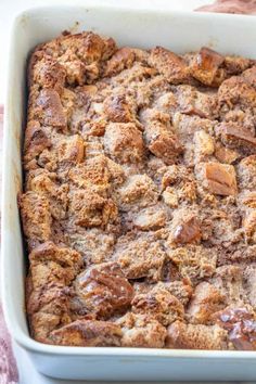 a casserole dish filled with bread and nuts