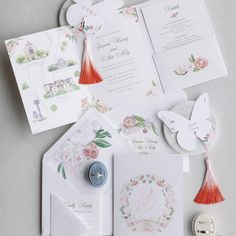 the wedding stationery is laid out on the table