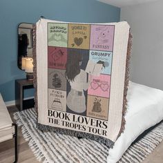 a book lover's the tropis tour blanket on a bed