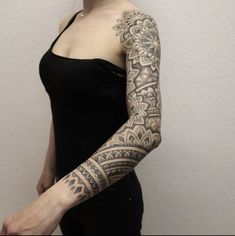 a woman with a tattoo on her arm