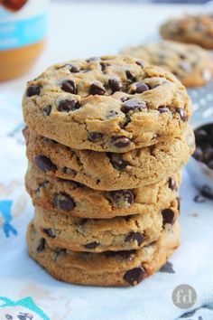 a stack of chocolate chip cookies sitting on top of a table