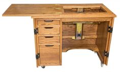 a wooden desk with drawers on wheels and an open drawer under the top that is closed