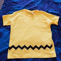 Nwot / Never Used Charlie Brown Themed Boys Tshirt. Had Mede For My Son But Didn't Fit Him. It Says Large But It's More A Medium. Will Fit A Slim Boy. Unisex Yellow Graphic Print Top, Cute Yellow Cotton T-shirt, Playful Yellow Top With Cartoon Print, Unisex Yellow Crew Neck T-shirt, Yellow Cotton Tops With Cartoon Print, Yellow Cotton Tops With Character Print, Cute Yellow Tops With Character Print, Cute Yellow Top With Character Print, Basic Yellow Pre-shrunk Tops