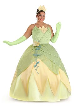 a woman in a green and yellow dress with her hands out to the side,