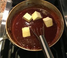 some cubes of butter are in a pan on the stove