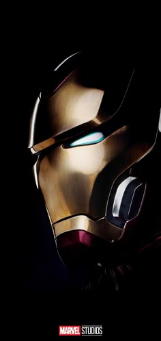 the iron man helmet is shown against a black background with light coming from its eyes