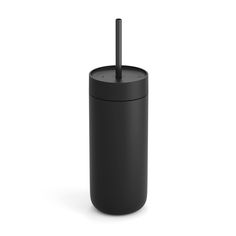 a black cup with a straw sticking out of it's side, on a white background