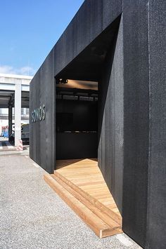 the entrance to an empty parking garage with steps leading up to it's door