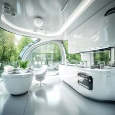 a futuristic kitchen with white furniture and large windows