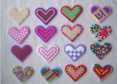 a bunch of different colored hearts on a white surface