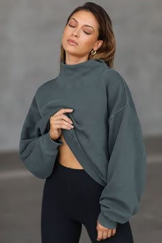 Front view of model wearing the comfortable evergreen french terry Turtleneck Sweatshirt pullover with a side split in the collar and a slightly oversized fit Brown Turtleneck, Brown Tops, Joah Brown, Turtleneck Sweatshirt, Layered Tops, Oversized Pullover, French Terry Fabric, Oversized Sweatshirt, Vintage Wear