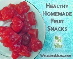 there is a white plate with red gummy bears on it and the words healthy homemade fruit snacks