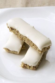 two pieces of cake sitting on top of a white plate