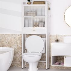 a white toilet sitting in a bathroom next to a shelf filled with books and magazines