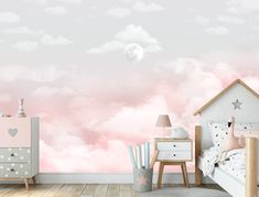 a bedroom with pink clouds and stars painted on the wall, along with two nightstands