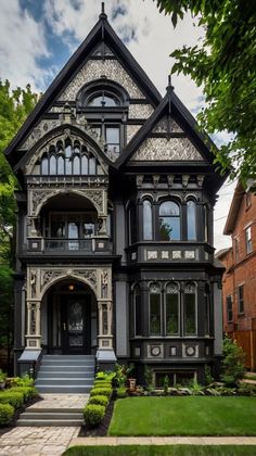 an old victorian style house with many windows