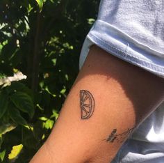 a person with a small tattoo on their arm