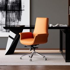 an orange office chair sits in front of a black desk with a white painting on it