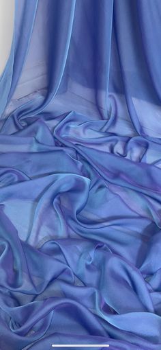 an image of a blue cloth that is very soft and drapeed with it