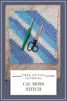 a pair of scissors sitting on top of a blue and white knitted blanket with text overlay