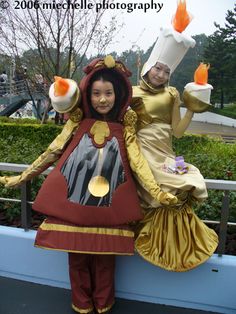 two people dressed in costumes posing for the camera