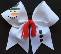 a close up of a snowman bow on a black background