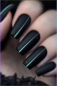 Matte black nails with an elegant and minimalist design, featuring a single, thin teal line running down the center of each nail. The subtle contrast between the matte finish and the shiny accents gives the nails a chic, contemporary vibe. Black And Turquoise Nails, Diy Nails Tutorial, Mint Nails, Teal Nails, Turquoise Nails, Matte Black Nails, Trendy Nail Art Designs, Teal Accents, Striped Nails