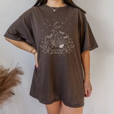 Get ready to be OBSESSED with your new mushroom shirt. It's the cutest and most trendy way to emit all those important trendy cottagecore vibes! This is the perfect  botanical shirt and growth mindset shirt!  * Q U I C K * F A C T S * ✺  All shirts are UNISEX ✺  100% Airlume combed and ringspun cotton (fiber content may vary for different colors) ✺ Wash and dry normally (on cool for best results) * S I Z I N G * ✺ For an oversized fit, select two or three sizes up from your normal size ✺ Model is wearing size L  ✺ Sizing runs true to size ✺ Most women find their typical size works best, since they are meant to fit a touch loose ✺ See Size guide and fit in images          * S H I P P I N G * T I M E S * ✺ Our items are individually made with love for each of our buyers. Because of this, our Indie T Shirts, Literature Shirt, Literary Shirts, Universal Shirts, Poet Shirt, Dark Academia Clothing, Feminism Shirt, Goth Shirt, Cottagecore Shirt